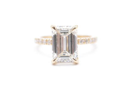 3ct emerald cut lab grown diamond center igi certified F color VS1 14k yellow gold diamond pave setting with accented unerhalo