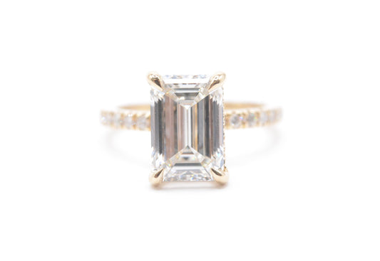 3ct emerald cut lab grown diamond center igi certified F color VS1 14k yellow gold diamond pave setting with accented unerhalo