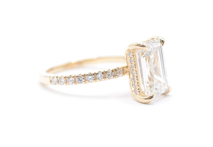 3ct emerald cut lab grown diamond center igi certified F color VS1 14k yellow gold diamond pave setting with accented unerhalo