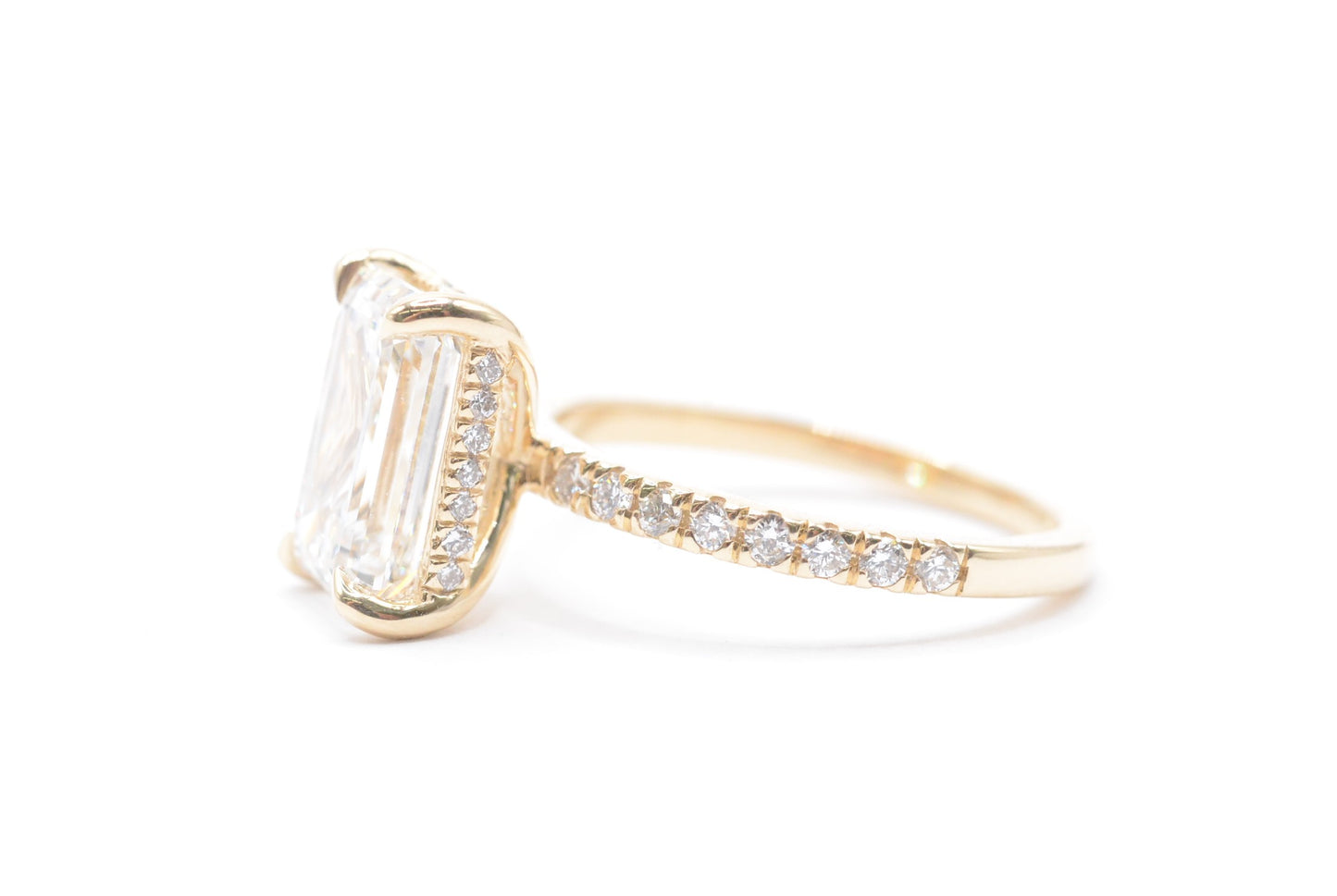 3ct emerald cut lab grown diamond center igi certified F color VS1 14k yellow gold diamond pave setting with accented unerhalo
