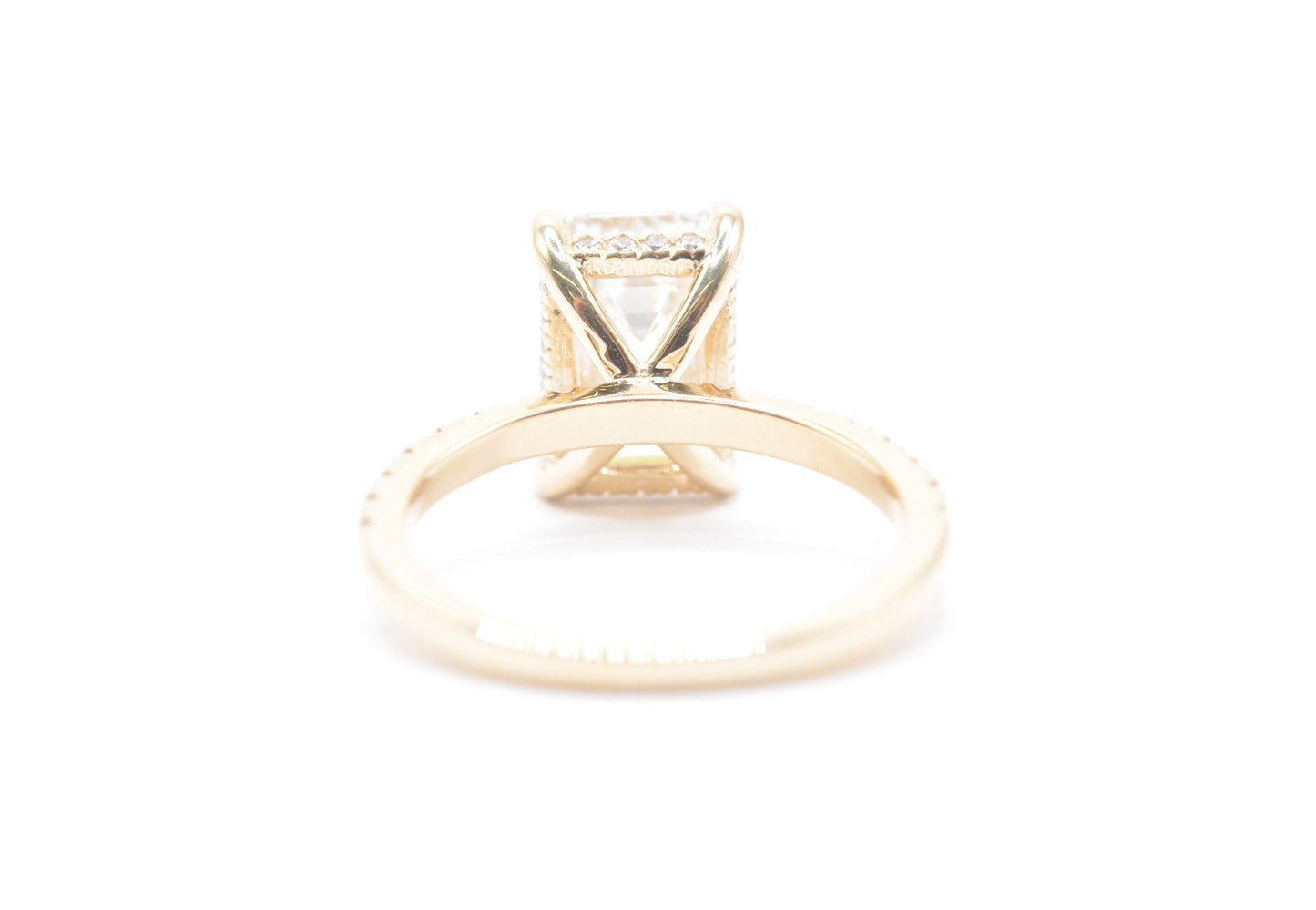 3ct emerald cut lab grown diamond center igi certified F color VS1 14k yellow gold diamond pave setting with accented unerhalo