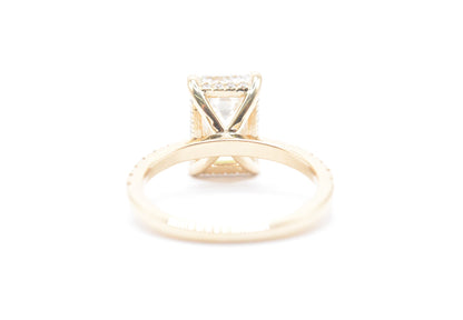 3ct emerald cut lab grown diamond center igi certified F color VS1 14k yellow gold diamond pave setting with accented unerhalo