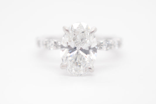 2.5ct Oval Lab diamond center IGI certified f color vs1 in custom marquis/round alternating eternity 14k white gold.
