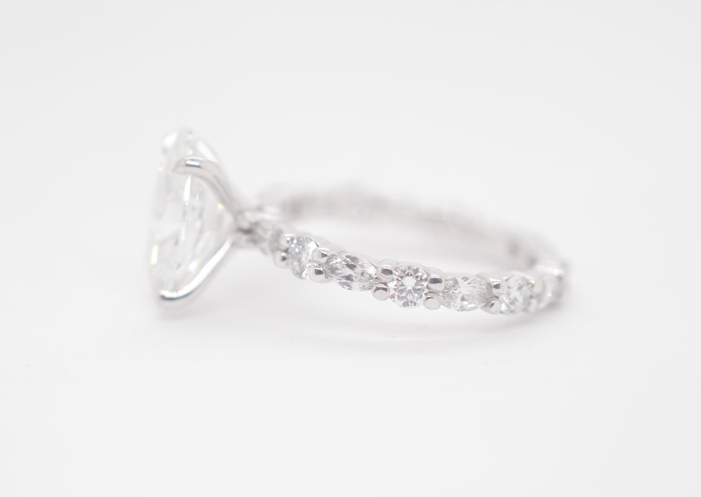 2.5ct Oval Lab diamond center IGI certified f color vs1 in custom marquis/round alternating eternity 14k white gold.