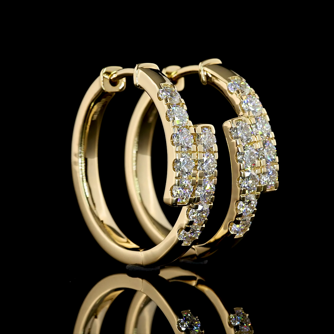 Gold hoop earrings with diamond accents on a black background